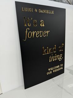 a sign that says it's a forever kind of thing welcomes us to our wedding