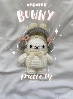 a crocheted stuffed animal sitting on top of a white sheet with the words, updated bunny written across it