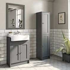 a bathroom with a sink, cabinet and mirror