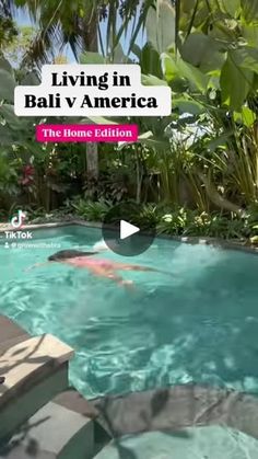 a person swimming in a pool surrounded by greenery and trees with the words living in bali v america