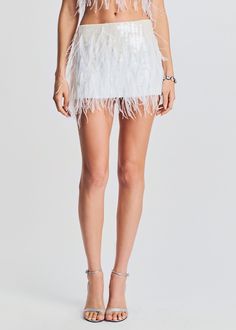 Our Athana Skirt will take any look to the next level. This playful mini features stunning sequins and feather embellishments throughout. Style it with a crisp white button-down and heels, or even a simple tee—there are no rules, just fun to be had. Shown here in White. HANDMADE Self: 100% Polyester, Trim: 100% Ostrich Chain Skirt, There Are No Rules, Australia Clothes, Feather Skirt, Chain Bra, No Rules, Simple Tees, Welcome To The Party, White Button Down