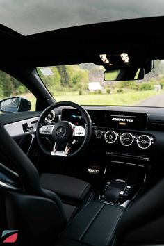 the interior of a modern car with dashboard lights and gauges on either side of the steering wheel