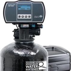 a water softener is shown in front of a black container with thermometer on it