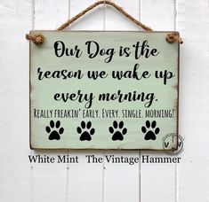 a sign that says, our dogs are the reason we wake up every morning