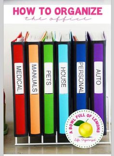 several books are lined up on a shelf next to a wine bottle and an apple