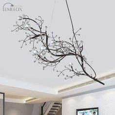 The Situla Metallic Thin Branch Chandelier with Crystal Bead is the epitome of elegance and romance. With its delicate metal branches in a metallic finish, this chandelier adds a touch of glamour to any space. The 10 lights illuminate your boutique with a warm and inviting glow, creating an enchanting ambiance. The crystal bead accents add a luxurious touch, reflecting the light and creating a mesmerizing effect. This suspension light is perfect for boutiques, adding a captivating focal point to your store. Whether you are looking to create a romantic atmosphere or simply want to elevate the style of your boutique, the Situla Metallic Thin Branch Chandelier is the perfect choice.Size: 25 Inch Above Fixture Width: 39" Bulb Included: No Canopy Shape: Round Number of Tiers: 1 Tier Material: M Pendant Light Set, Patio Remodel, Branch Chandelier, Pendant Light Styles, Luminous Colours, Suspension Light, Black Chandelier, Romantic Art, Lighting Inspiration