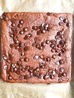 a chocolate cake with lots of chocolate chips on it