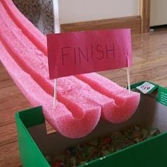 a box that has some pink towels in it with the word finish written on it