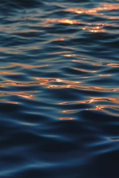 the sun shines brightly in the water as it reflects on the surface of the ocean