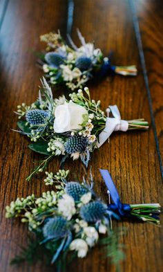 wedding flowers laid out on a wooden table