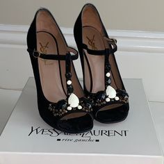 Yves Saint Laurent - Cabaret 105 T-Strap (Black) Stunning Whether You Wear These For Black Tie, Cocktail, Or To Feel Special With Your Favorite Jeans, Your Outfit Will Shine. Yves Saint Laurent Quality And Style At Its Best. Don't Go For The Typical Ysl Look. Go For A Special Version. Black Suede Pumps With T-Strap And Decorative Black And White Stones. In Very Good Gently Used Condition. Original Price $1095 Approximately 4.5 Inch Heel Yves Saint Laurent Shoes, White Stones, Black Suede Pumps, 5 Inch Heels, Suede Pumps, Feel Special, Cabaret, T Strap, Favorite Jeans