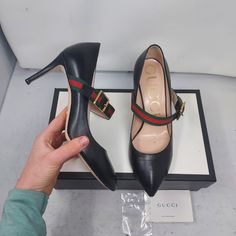 Gucci Black Leather Sylvie Mary Jane Web Pump Size Eu 38 Us 8 Womens Comes With Box 100% Authentic All Black Heel With Signature Gucci Web Across The Upper With A Gold Buckle Slim Heel Red Green Web Heels: 3" Please Note Signs Of Wear On Bottom As Shown. Please Note Any Scratches/Lines Have Been Polished Over As Shown. Please Note Signs Of Wear On Heel As Shown Gucci Black Heels With Buckle Closure, Gucci Leather Heels For Business, Designer Ankle Strap Heels For Business, Gucci Ankle Strap Heels In Calf Leather, Gucci Ankle Strap Leather Heels, Gucci Business Heels With Branded Heel Counter, Gucci Round Toe Heels With Buckle Closure, Gucci Heels With Buckle Closure And Round Toe, Gucci Ankle Strap Heels For Office