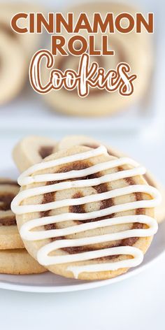 cinnamon roll cookies with icing on a white plate