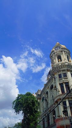 an old building with a clock on the top