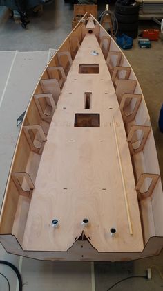 a wooden boat being built in a workshop