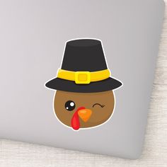 a sticker with a turkey wearing a pilgrim hat on it's face and eyes