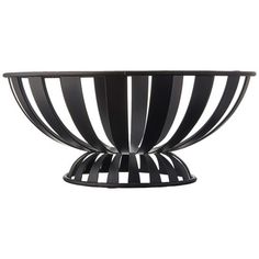 a black and white striped bowl on a stand with an oval base in the center