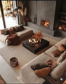 a living room filled with lots of furniture next to a fire place in a fireplace