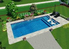 an aerial view of a swimming pool in the middle of a lawn and garden area