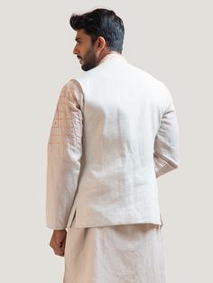 This Asymmetric Thread Nehru Jacket will instantly give an elegant look. This Nehru Jacket features in linen fabric with an asymmetric cut, web style geometric threadwork, sequin embroidery, invisible front button placket, and a mandarin collar. An ideal outfit for traditional occasions, and special events.

Size Chart For Men





	
	
					Men's Size Chart
		

		
		
						
				Size Chart For Men
				Custom Size Measurement Guide
			
			
				
				
				Custom Size Measurement Guide
1. Take your m Luxury Classic Nehru Jacket With Concealed Placket, Luxury Tailored Nehru Jacket For Fall, Luxury Traditional Chanderi Nehru Jacket, Ceremonial Luxury Cream Nehru Jacket, Luxury Nehru Jacket With Printed Motifs, Luxury Formal Spring Nehru Jacket, Luxury Nehru Jacket For Semi-formal Occasions, Luxury Spring Nehru Jacket For Formal Occasions, Spring Luxury Cotton Silk Nehru Jacket