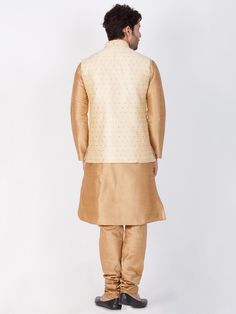 Vastramay Rose Gold Silk Blend Baap Beta Jacket Kurta Pyjama set A stunning combination of traditional and contemporary style, the Vastramay Rose Gold Silk Blend Baap Beta Jacket Kurta Pyjama Set is a must-have for special occasions. Crafted from high-quality silk blend fabric, this set features a kurta with intricate detailing paired with comfortable pyjamas and a matching jacket. Make a statement with this elegant ensemble. Features: Includes a kurta, pyjama, and jacket Made from premium silk blend fabric Exquisite embroidery and embellishments Perfect for festive and celebratory occasions Specifications: Brand: Vastramay Color: Rose Gold Material: Silk Blend Sleeve Type: Full Sleeves Occasion: Festive, Party Material & Care: Silk Blend. Dry clean only. Legal Disclaimer: The product is g Kurta Pyjama, Comfortable Pajamas, Boys Wear, Gold Silk, Full Sleeves, Pyjama Set, Gold Material, Full Sleeve, Sleeve Type