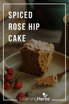 a piece of spiced rosehip cake on a plate with a fork next to it