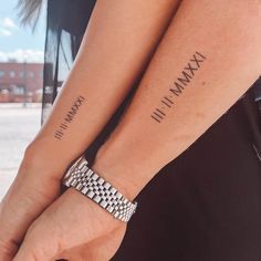 two people are holding hands with tattoos on their wrists and wristbands that read, i love my mama