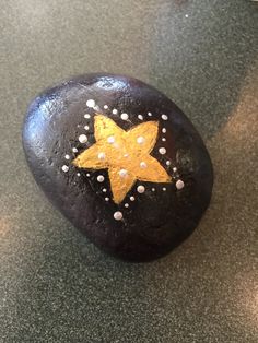 a star painted on top of a rock