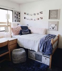 a small bedroom with a bed, desk and chair