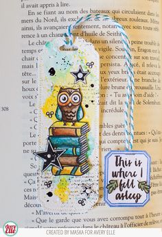 a bookmark with an owl on top of it