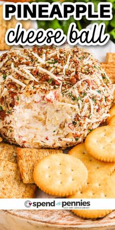 a cheese ball on top of crackers with the words pineapple cheese ball above it