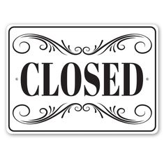 a black and white sign with the word closed on it's front side, in an ornate frame