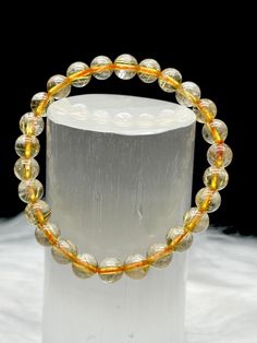 Welcome to our enchanting collection featuring the mesmerizing healing energy of Gold Rutile Quartz Crystal! Indulge in the beauty and benefits of this exquisite crystal with our specially crafted round bead bracelet. Each bracelet is meticulously made with very high-quality 8mm Gold Rutile Quartz beads, strung on a stretchable cord for comfort and flexibility. ✨ Why Choose Gold Rutile Quartz Crystal? Gold Rutile Quartz is renowned for its stunning golden needle-like inclusions that captivate the senses. This crystal is believed to harness powerful healing energies, offering a unique blend of spiritual and physical benefits. As you wear this bracelet, you may experience heightened spiritual awareness, amplified intuition, and a deep sense of tranquility. 🔮 Intuitively Selected Just for Yo Adjustable Gold Crystal Bracelet Spiritual Style, Gold Faceted Crystal Bracelet Spiritual Style, White Faceted Crystal Bracelet, Spiritual Style, Spiritual Gold Crystal Bracelet, Hypoallergenic, Adjustable Rose Quartz Bracelets - Spiritual Style, Rutile Quartz, Spiritual Awareness, Quartz Beads, Healing Energy