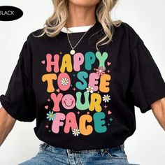 Happy To See Your Face Shirt, Teacher Shirts, First Day Of School Shirt Discover Our Latest Range Of Versatile And Stylish T-Shirts (Gildan 5000), Where Style Harmonizes With Unparalleled Comfort! Featuring Sizes From S To 3xl And A Vibrant Spectrum Of Colors Such As Black, White, Sand, Green, Sport Grey, Red, Navy, And More, There's A Choice To Cater To Every Taste. Crafted With Precision Using Top-Notch Materials, Our T-Shirts Offer A Luxurious Sensation And An Impeccable Fit That Endures Thro Black Slogan Shirt For Spring, Black Top With Funny Text For Spring, Black Spring Top With Funny Text, Spring Black Top With Funny Text, Fun Black Tops With Text Print, Fun Black Top With Text Print, Fun Black Slogan Top, Fun Black Shirt With Letter Print, Black T-shirt With Funny Text For Spring