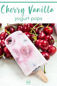 cherry vanilla yogurt pops on a white table with cherries and text overlay that reads, cherry vanilla yogurt pops