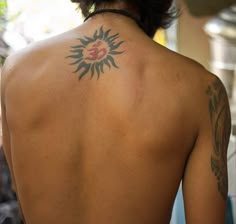 a person with a tattoo on their back