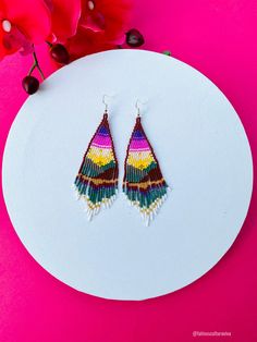 These beautiful beaded earrings are so colorful and perfect for all-day wear. They are definitely the perfect accessory to style up your look and add personality to your outfit. These lovely handmade earrings are made with sterling silver hooks and colorful beads. Each pair of earrings that we sell is authentic and one-of-a-kind! Finds more styles at https://www.etsy.com/shop/LatinxsCulturaViva?ref=simple-shop-header-name&listing_id=990207426&section_id=26730499 Thank you so much for vis Beaded Rainbow Drop Earrings, Colorful Tiny Beads Dangle Earrings, Colorful Dangle Earrings With Tiny Beads, Rainbow Dangle Earrings With Tiny Beads, Handmade Colorful Beaded Drop Earrings, Multicolor Tiny Beads Earrings For Festival, Multicolor Beaded Drop Earrings For Pierced Ears, Multicolor Tiny Beads Earrings For Gift, Multicolor Drop Beaded Earrings For Pierced Ears