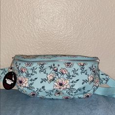 Brand New With Tags Fanny Pack Or Waist Pouch. All I Know For Sure Is That They Are Back And They Are In Style! This Light Blue Or Even A Mint With A Floral Pattern. It’s Adjustable Strap To Accommodate Many Sizes And Shapes. Casual Blue Bag With Zipper Pouch, Light Blue Casual Bags For Spring, Cute Blue Bag For Spring, Cute Blue Spring Bag, Dolce And Gabbana Clothes, Fringe Leather Belt, Vera Bradley Weekender Bag, Rolling Duffle Bag, Pink Duffle Bag