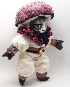 a doll dressed up as a pirate