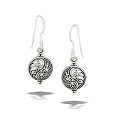 silver earrings with filigrees and swirly design on the drop ear wires