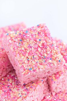 pink and gold sprinkles are stacked on top of each other