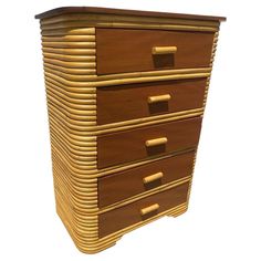 a tall wooden dresser sitting on top of a white floor