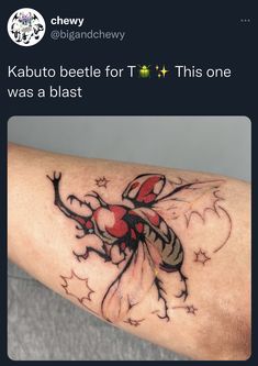 a person with a tattoo on their arm that reads kabuto beetle for t this one was a blast