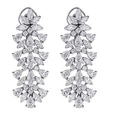 These impressive 18kt white gold drop earrings showcase 15.32cts of dazzling marquise, pear, and round diamonds in an elegant multilevel design. Handcrafted in Italy by ZYDO Italian Jewelry.Diamond Quality: Color F, Clarity VSDiamond Carat Weight: 15.32Dimension: 2 1/8 in. x 3/4 in. White Gold Drop Earrings, Italian Jewelry, Jewelry Diamond, Gold Drop Earrings, Long Earrings, Round Diamonds, Pear, Diamonds, White Gold