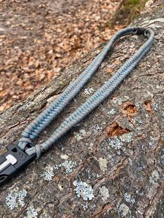 a cord attached to a rock in the woods