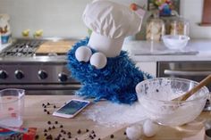 a cookie monster is standing on the kitchen counter