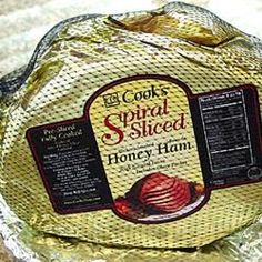 a piece of bread wrapped in foil on top of a counter next to other items