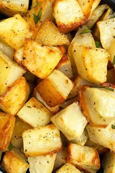 cooked potatoes with herbs and seasoning in a pan