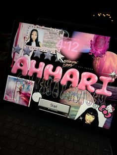 a laptop computer sitting on top of a desk with the word ahaart spelled out