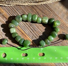 Large Canadian Jade Nugget Bracelet. Bracelet measures approximately 8 inches - adjustable cords pulls up to 9 inches. All of our jade is 100% natural nephrite jade, each piece of jade varies from the next so may not be exactly as shown. Sold by GIA Graduate Gemologist Nugget Bracelet, Nephrite Jade, Bead Bracelet, Shades Of Green, Live Lokai Bracelet, Mens Bracelet, Jade, The Next, Beaded Bracelets